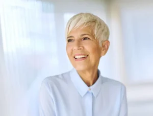 Older senior female smiling in an office setting