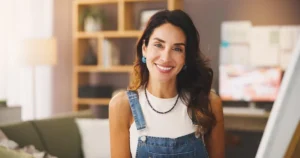 Portrait of a happy young woman smiling in a home setting