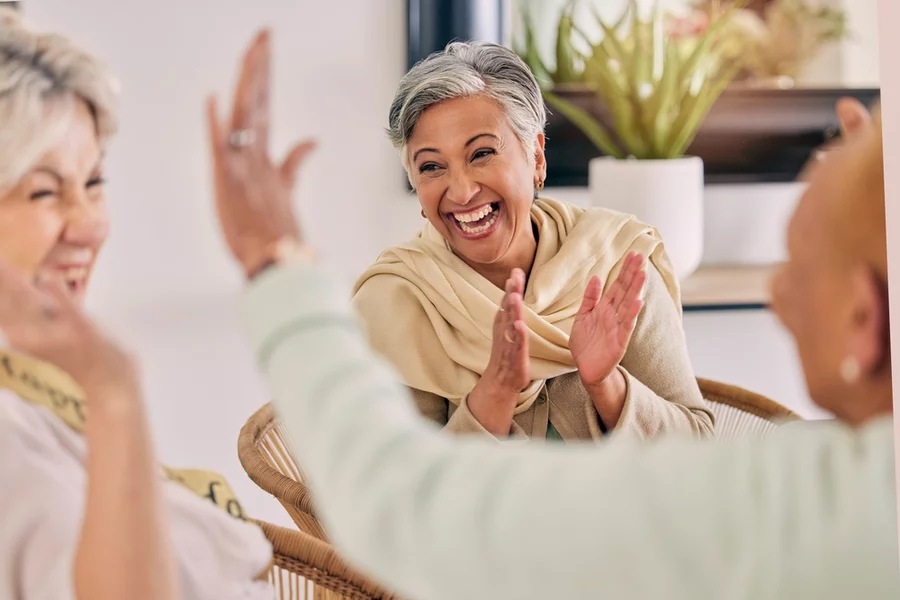 Woman smiling and laughing with friends