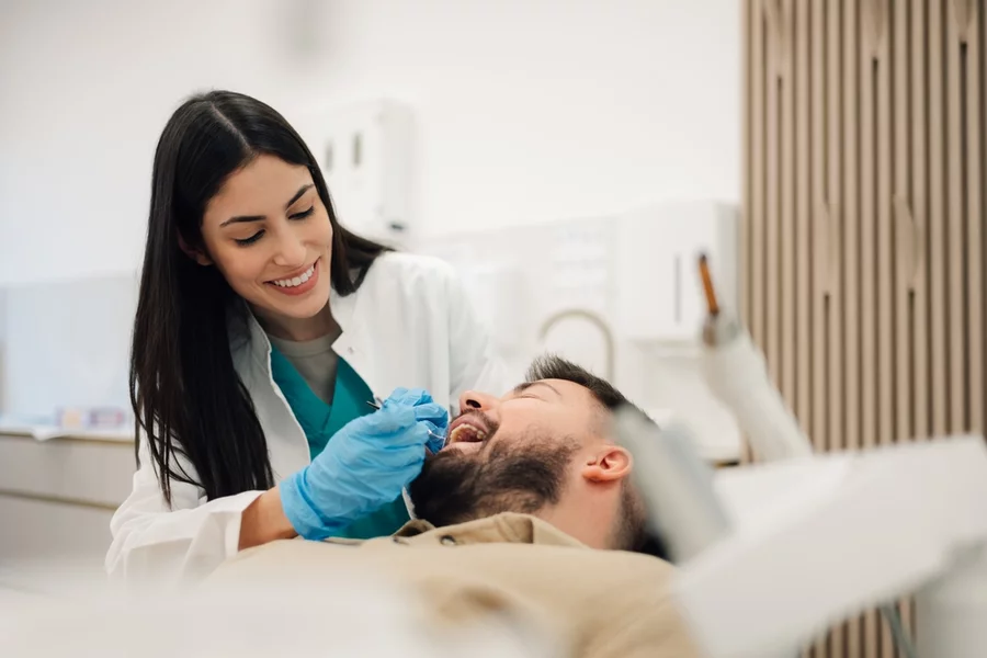 Dentist checking a patient’s wisdom teeth.